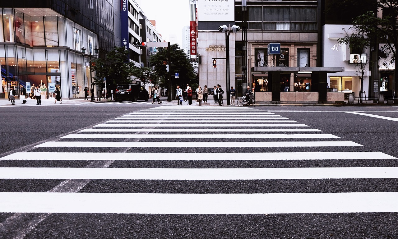 buildings, pedestrian crossing, city, crossing, pedestrians, people, road, street, city street, city, road, road, road, street, street, street, street, street, city street